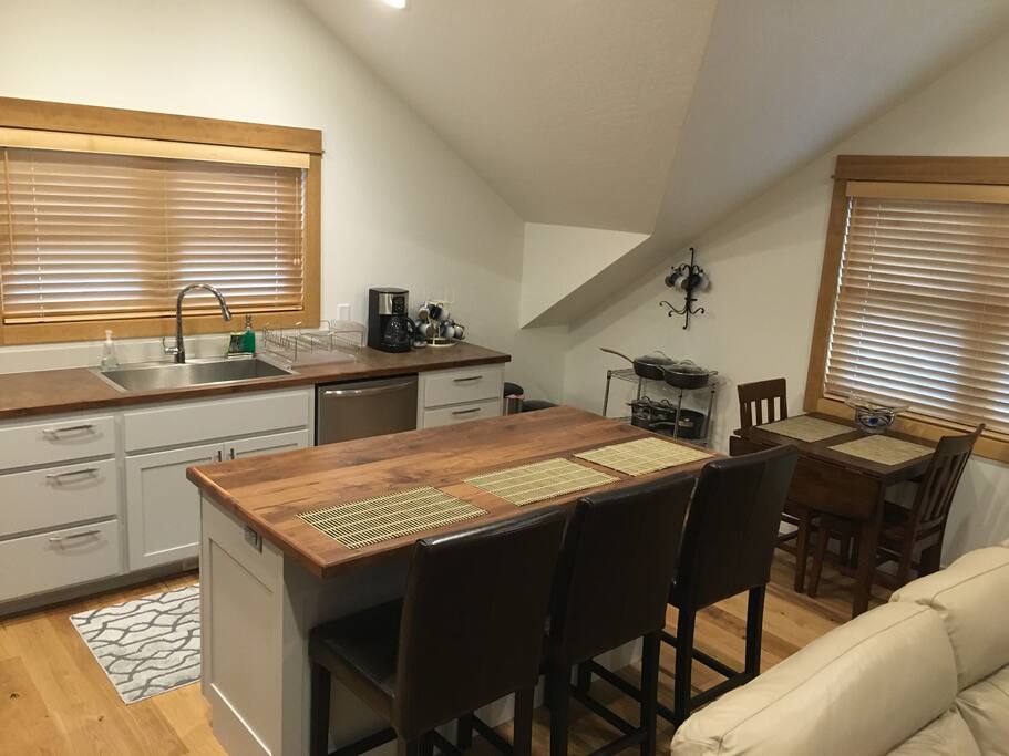 Bar seating for three. Dining table for two. Dish washer & coffee maker.