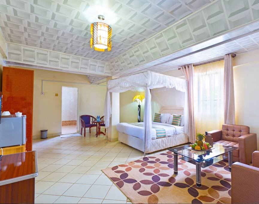 Our bed and siting room