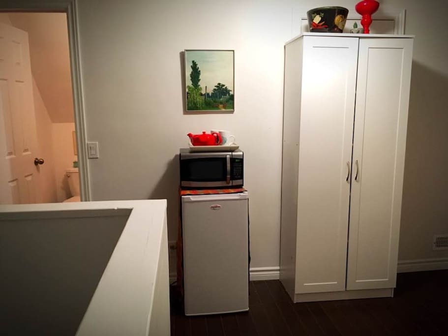 Fridge, microwave and pantry cupboard