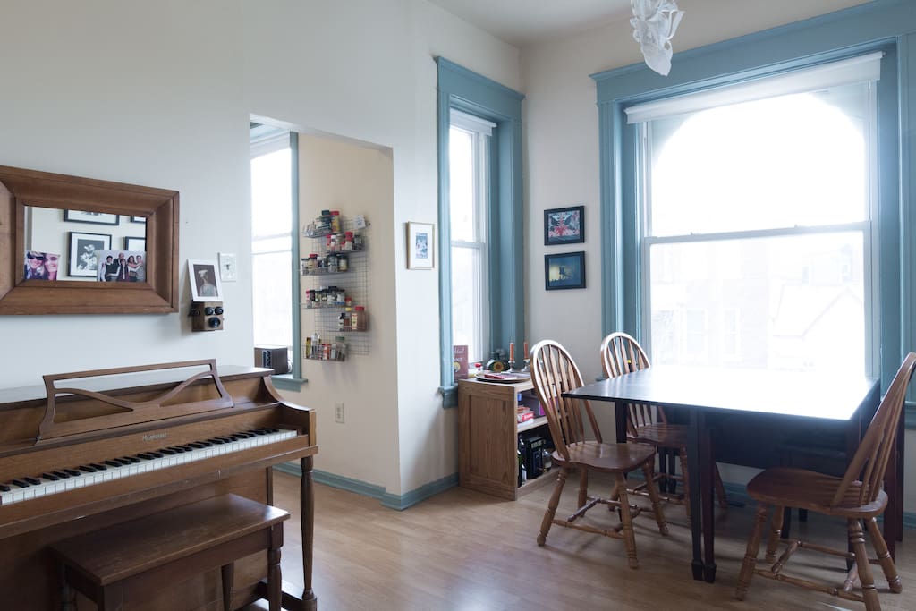 Dining room lined with huge south-facing windows gets great light all day.