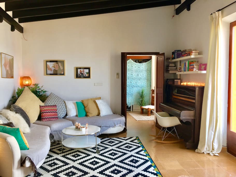 The lounge area with piano and beautiful corner sofa and another balcony offering more amazing views.