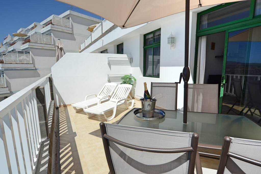 Spacious Private Terrace with Dining Table and Sunbeds