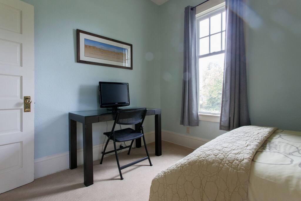 Desk with TV equipped with Google Chromecast and Netflix.