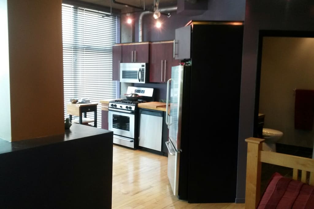 View from the bed to the kitchen area.