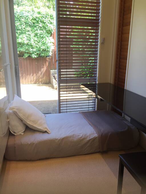 Comfortable single bed on floor