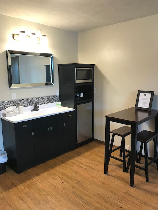 Dining area with mini-fridge, microwave, coffeemaker, and locally roasted coffee from Normal Roasting Co.
