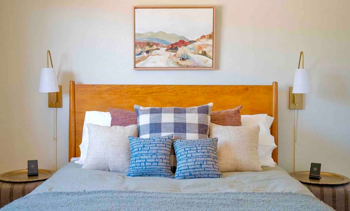 This bedroom features a comfortable Queen size memory foam mattress with blackout blinds for a restful night. Extra comforts include two bedside wireless phone chargers, built in bedside outlets with USB/USB-C ports and a luggage rack in the closet.