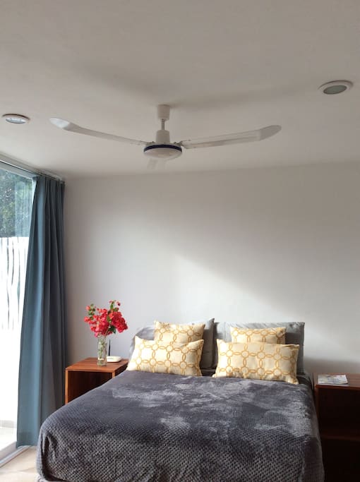 Ceiling fan and AC unit in the bedroom for your confort.