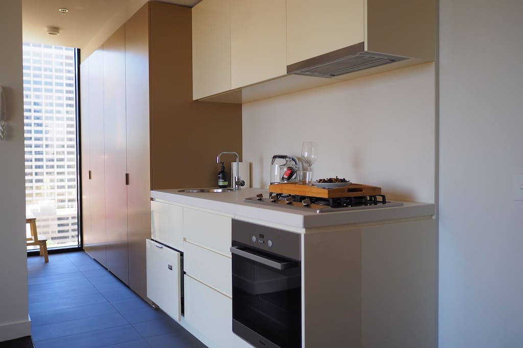 Fully equipped open-plan kitchen with plenty of light. (Miele gas-top stove, Miele oven, microwave, dishwasher, Nespresso machine and kettle)
