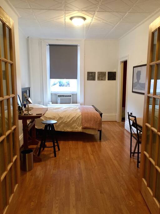 bedroom with 2 desks, walk-in closet