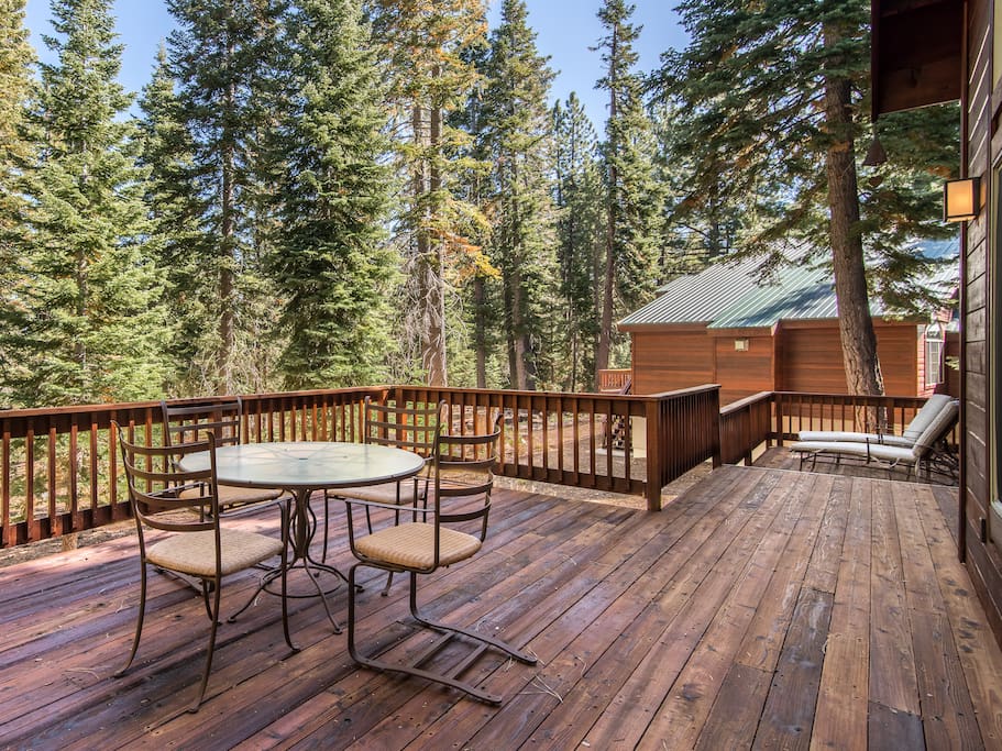 A spacious deck provides seating for 4 and a pair of loungers.