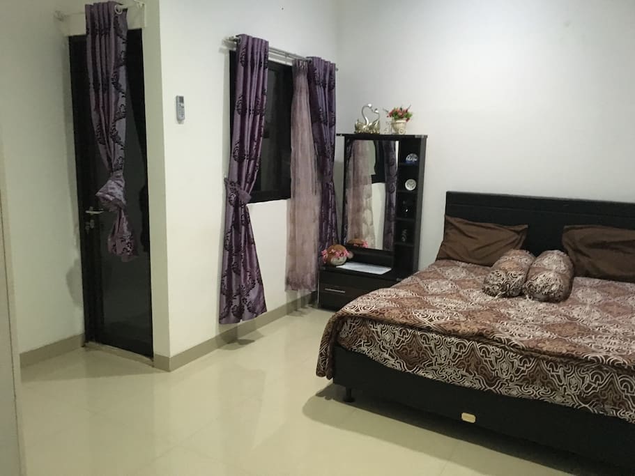 Bed room with windows and door, we are also providing extra single bed and air bed