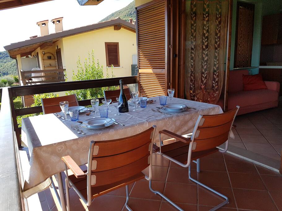 Panoramic terrace with dining table.