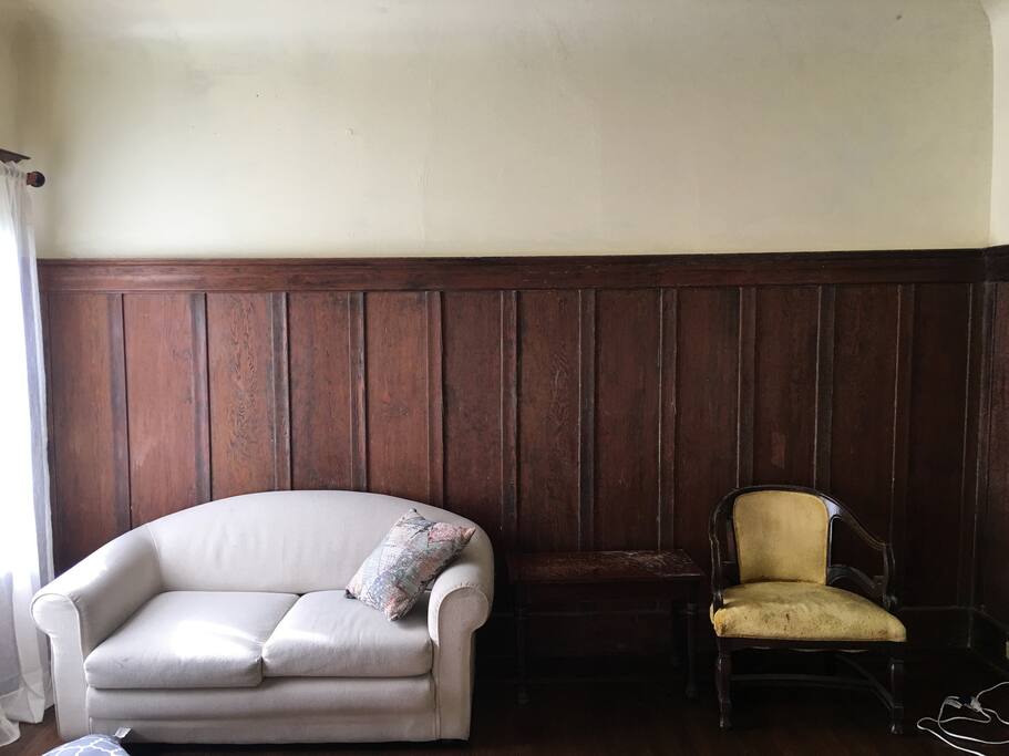 Large shared living room with window seats