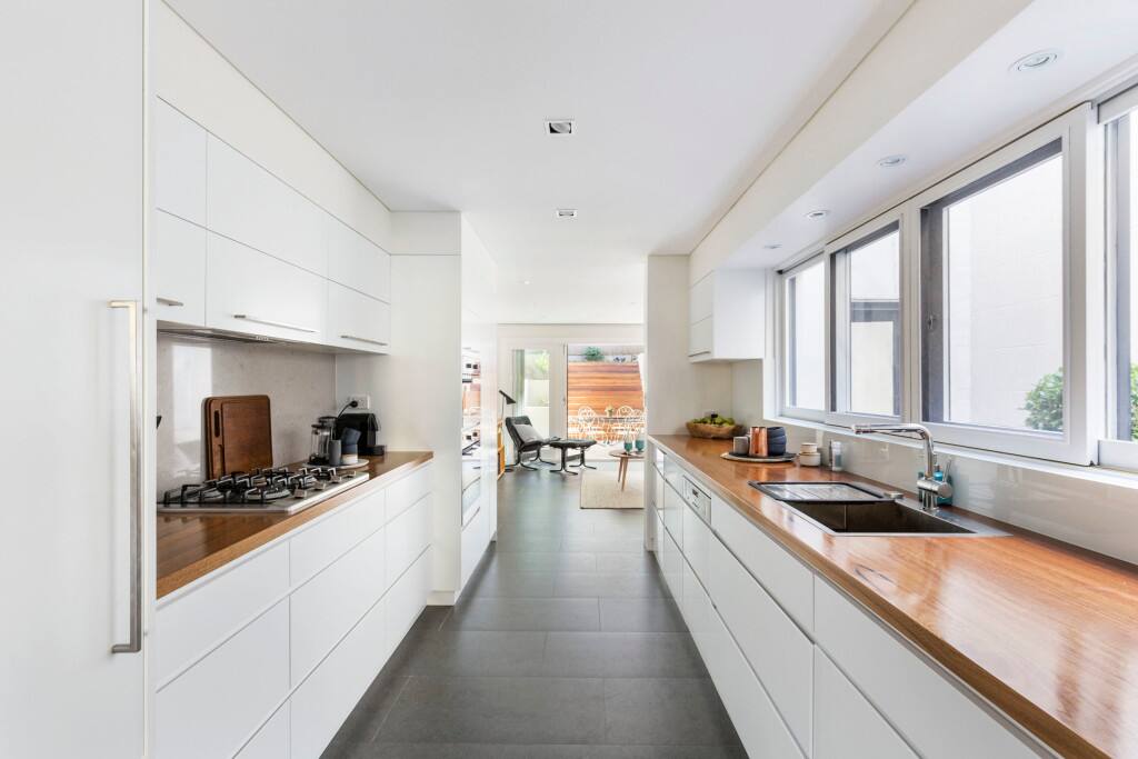 Modern kitchen with integrated fridge and washing machine