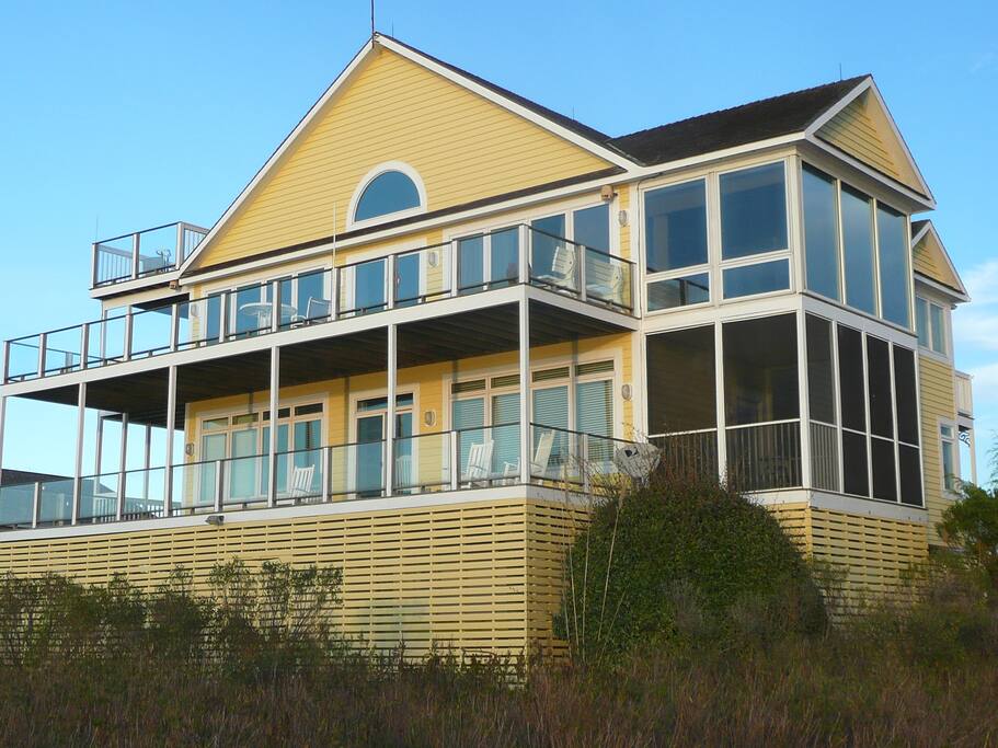 Back of home facing long water views.
