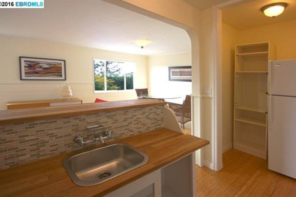 Kitchenette connects to living room. It has a fridge, hot plate, microwave, and toaster oven. An outdoor grill is available also.