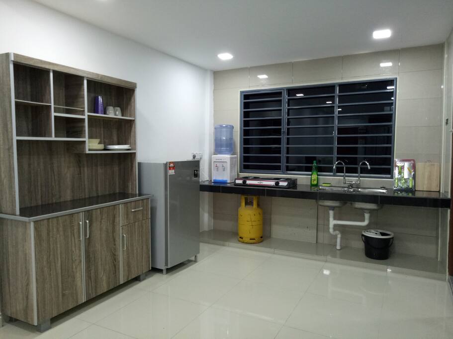 Kitchen - refrigerator, hot & warm water dispenser, gas stove, basic kitchenware...
