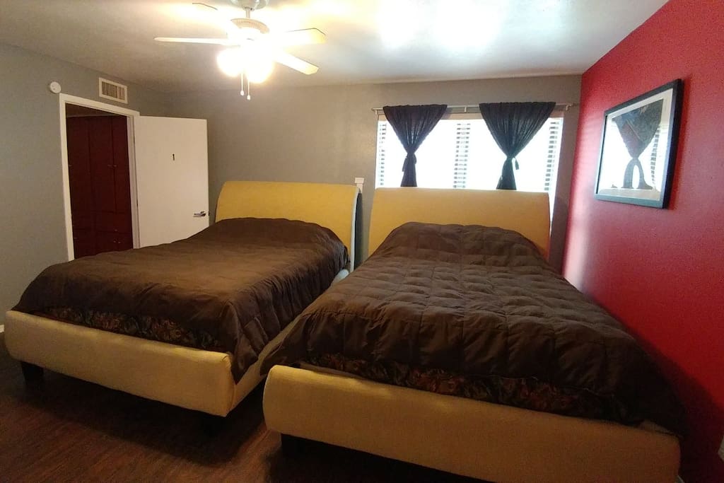 master bedroom with 2 queen beds