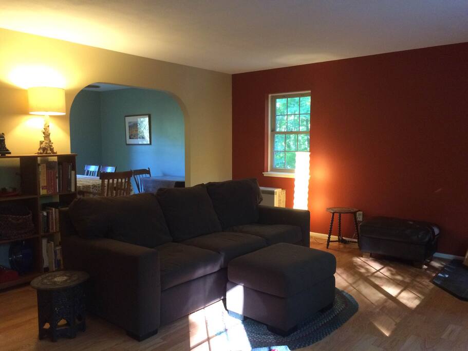The living area is open to the dining room and kitchen.