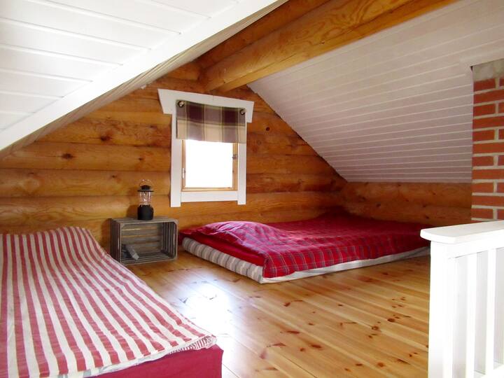 Saunan parvi. Bedroom upstairs, loft, sauna & guesthouse. Mattresses 120 cm and 80 cm. Fan and electric heater. Fireplace downstairs in sauna cabin.