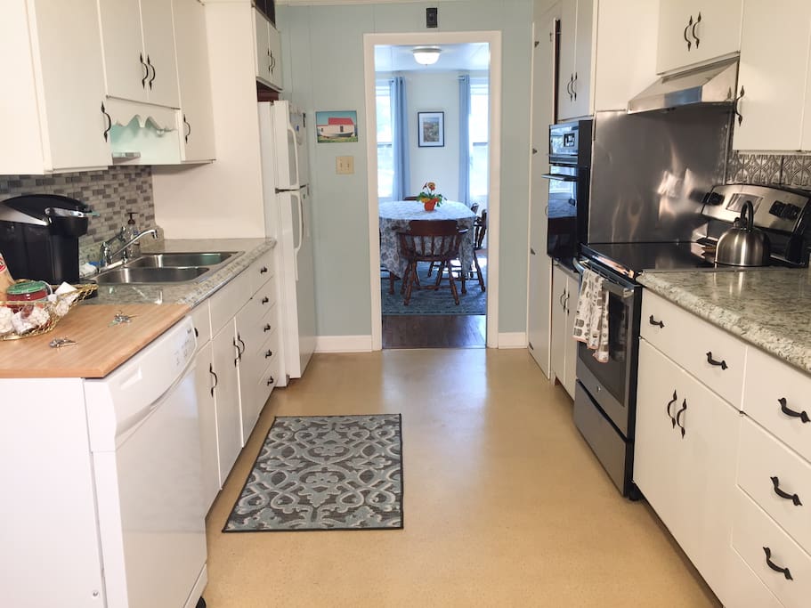 Kitchen has 2 ovens, microwave, toaster, Keurig, 12 cup coffee maker, coffee bean grinder, dishwasher, blender, and all the dishes, pots, pans, dishes and utensils you need.