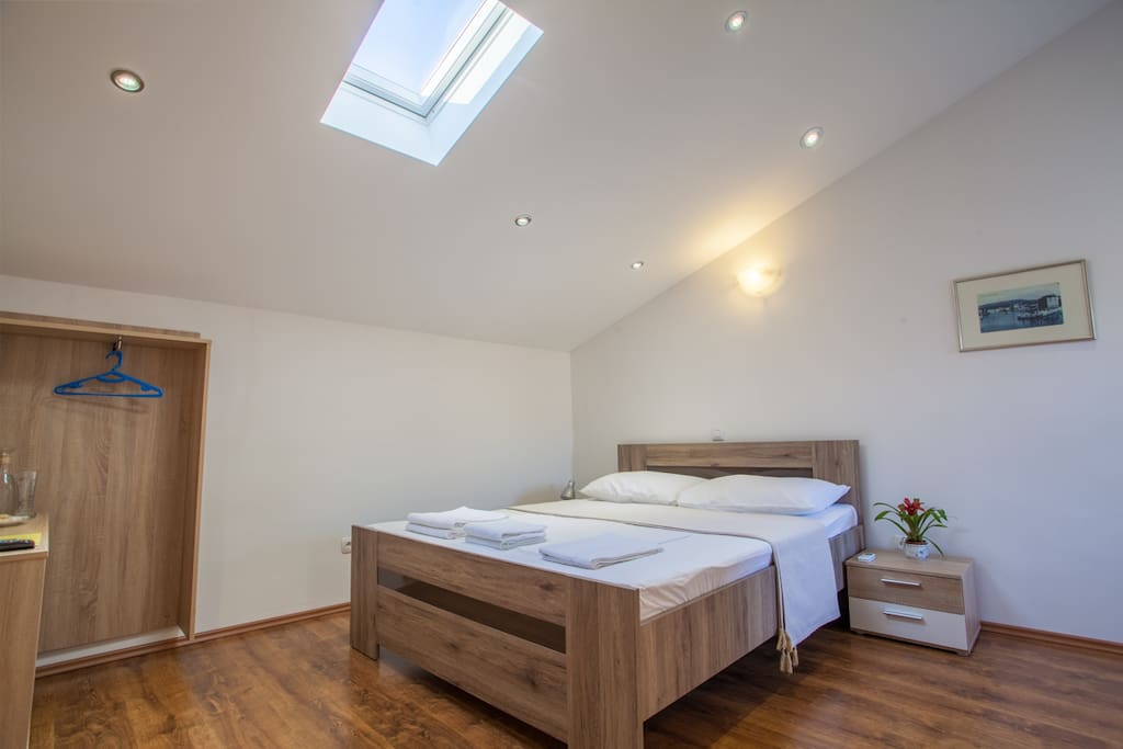 Room is furnished with a queen sized, hand made bed, with a skylight above for lots of natural light.