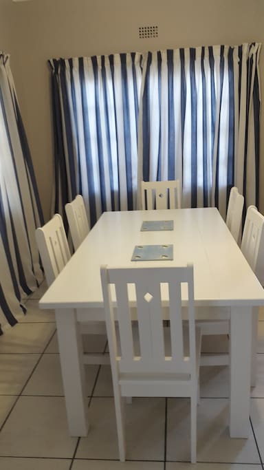 An 8 seater dining room table .
