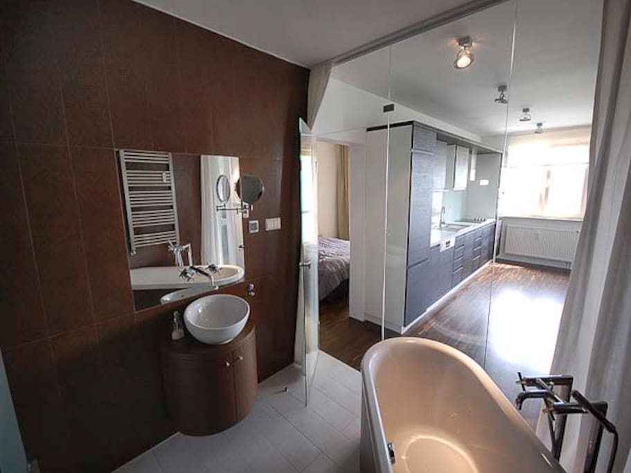 Bathroom with bathtub and shower cabin
