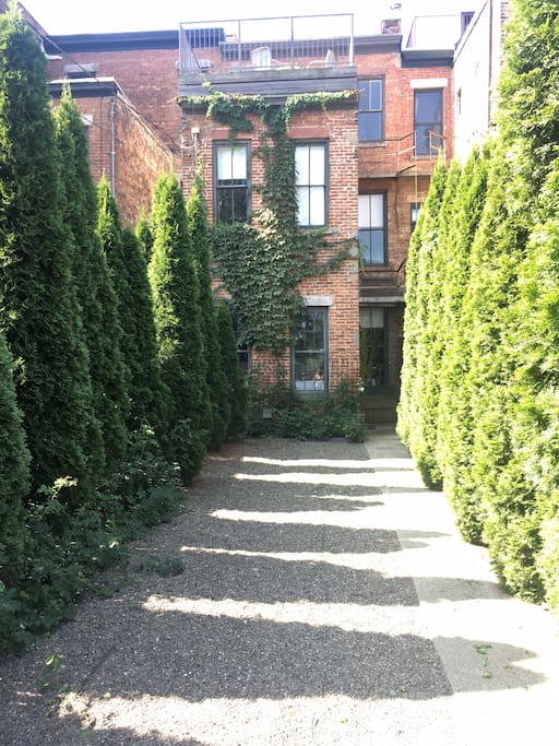 The private parking space out back leads into the rear yard.