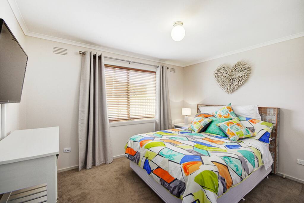 Main bedroom with additional TV