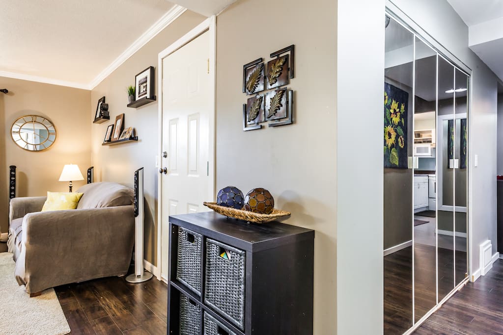 Looking towards the hallway from the bedroom. For guests travelling with small kid(s), toys can be found in the 4 bins (front and centre)