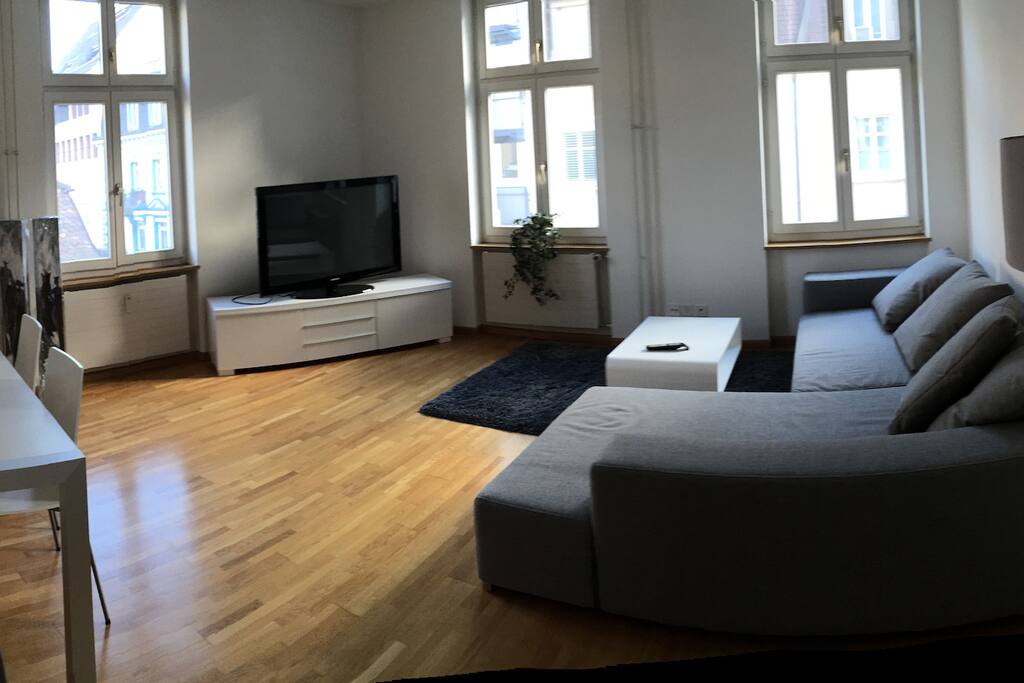 living room with a high quality couch that can be converted in a double bed