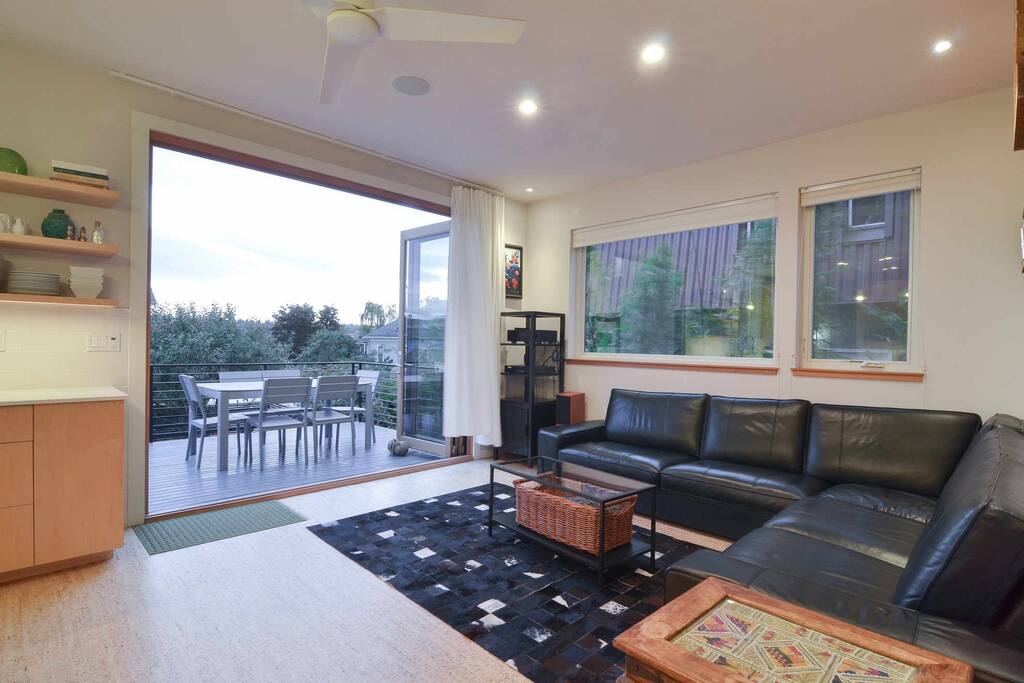 Seattle summertime can come inside when you open the house all the way up--A large three panel door opens a whole wall in the living room.