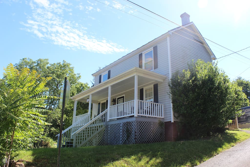 Perched atop a hill, the house affords lovely views.