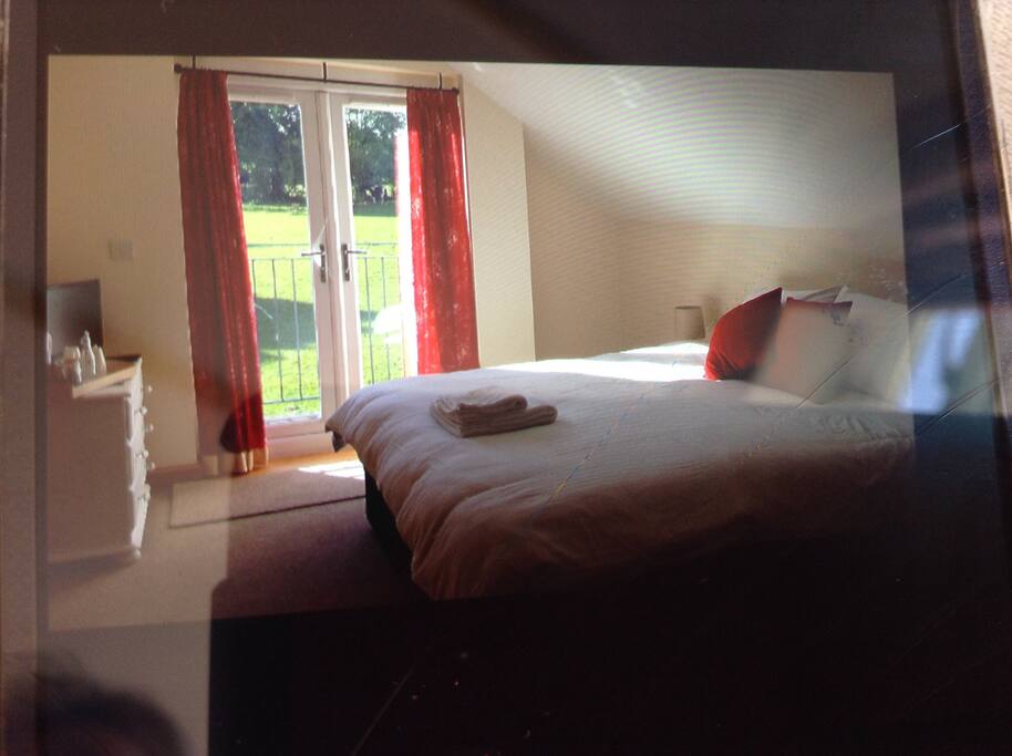 Balcony doors open onto quiet south facing views