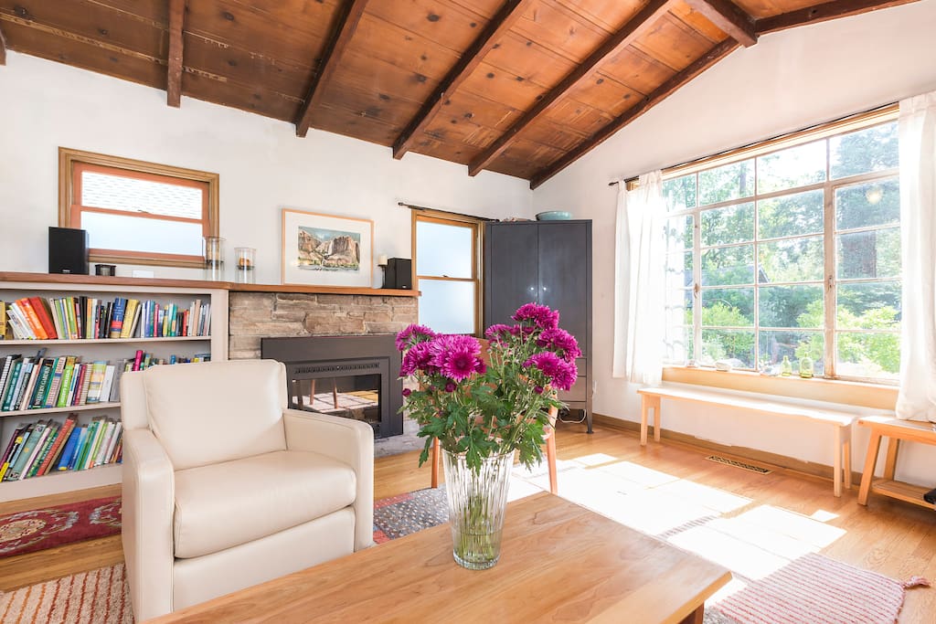 Comfortable living room with gas fireplace overlooking the peaceful garden. Light filled most of the day.