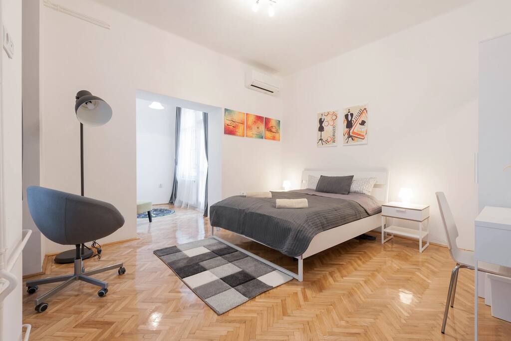 This is the first bedroom, the balcony entrance in the background