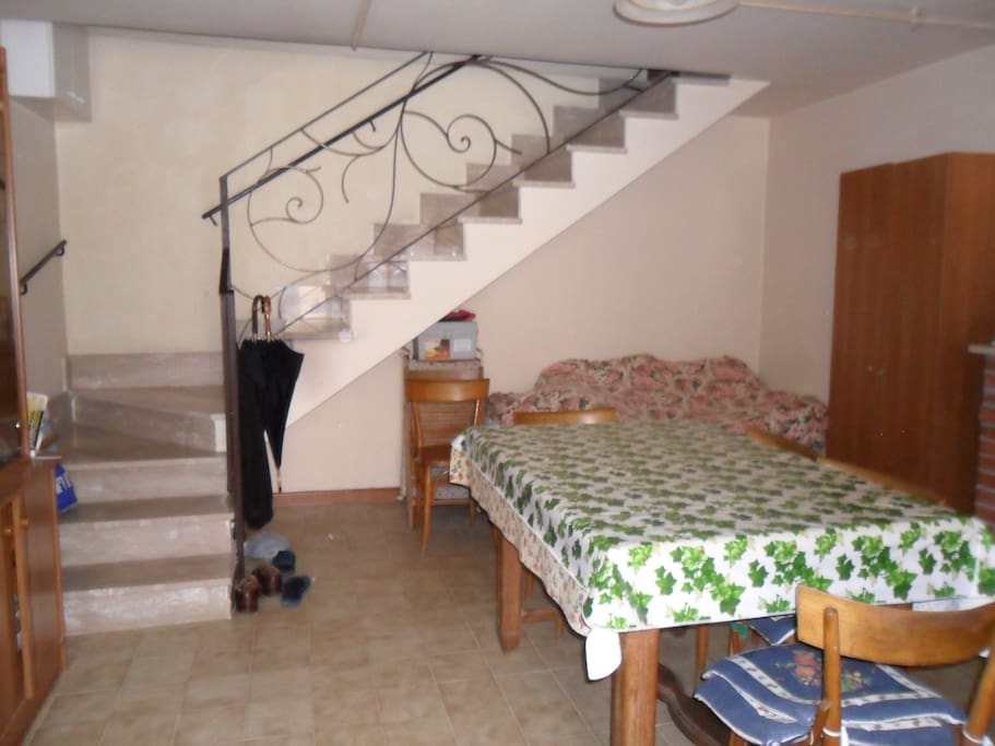 ground floor with electric stove and sofa (bed)