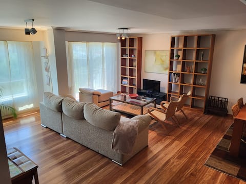 Bright and cozy in a green area