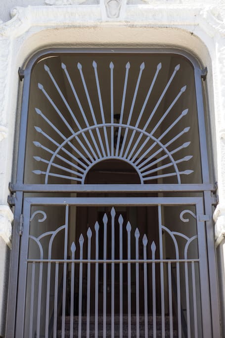 Enter through custom iron gate forged by Bayview district craftsmen.