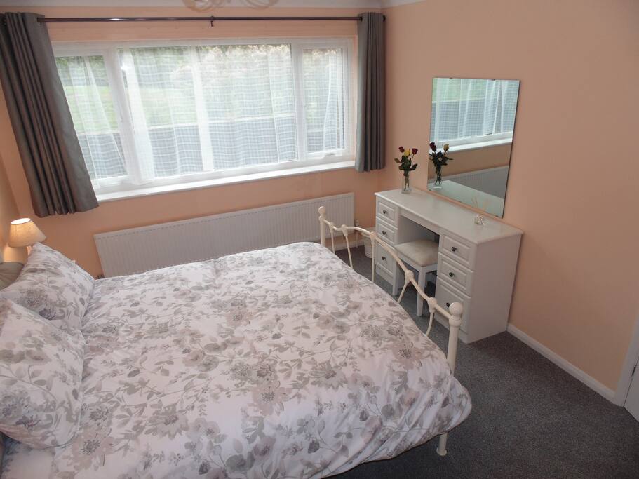 King size bed and built in wardrobe with lockable door