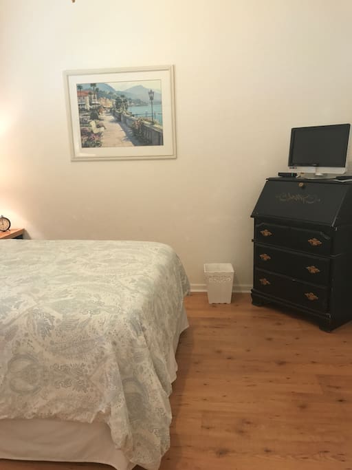 Dresser with fold down desk-top hardwood floors.