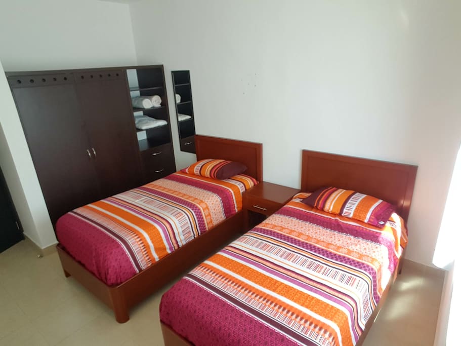 Bedroom with 2 single beds or 1 king size with AC