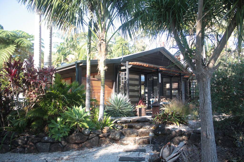 The front of the house is approached via the landscaped gardens.