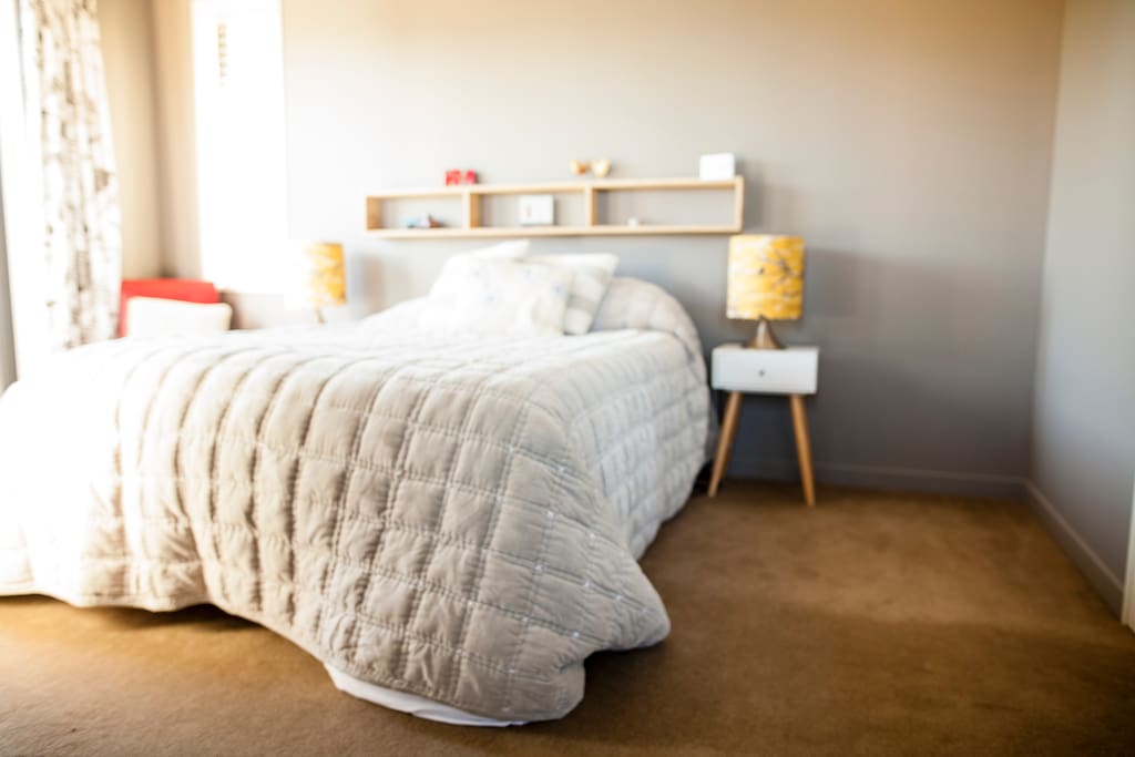 Your room, queen bed and French doors to the court yard