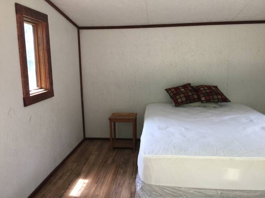 Queen bed. We have two single hide a beds for extra campers