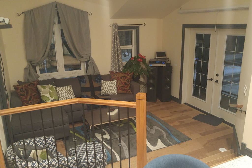 Living room with hide-a-bed and projection screen