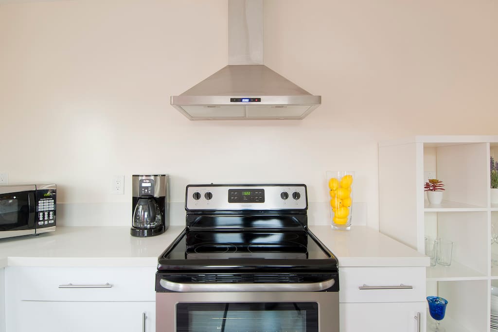 New kitchen with brand new stainless steel appliances and fully stocked for cooking your favorite meals away from home.