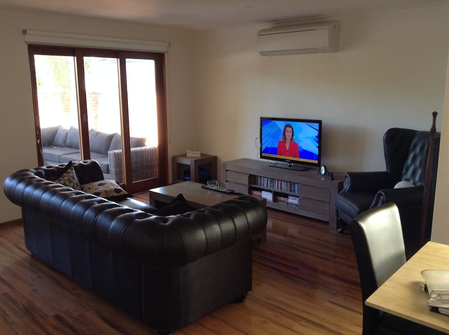 Lounge room with split system air-conditioning for cooling and heating